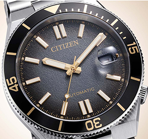 Citizen Tsuyosa Shore Time Slip, gros plan sur le cadran noir texturé et la lunette graduée dorée